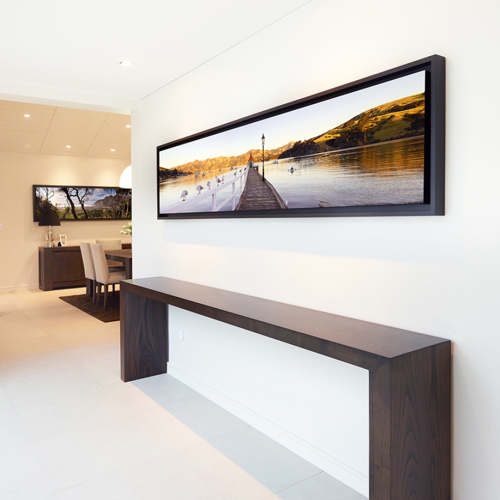 "Bonjour Akaroa" 606mm x 2440mm & "Karekare Magic" 812mm x 2284mm framed canvases (both print editions are sold out).